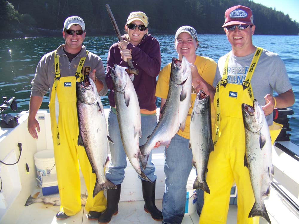 family with their catch of salmon