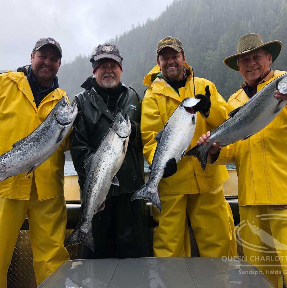 two families with their catch of salmon